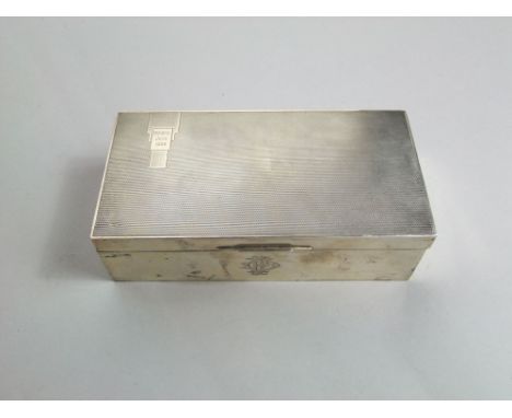 A silver cigarette case with engine turned decoration 18 cm max