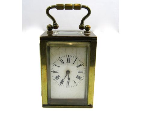 Antique French brass cased miniature carriage/boudoir clock, with bevelled glass top with open escapement, enamelled dial wit