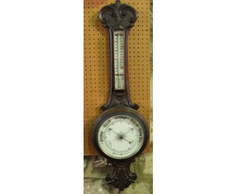 Late 19th century carved oak aneroid barometer, 86cm high