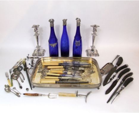 Mixed lot of silver plate to include a pair of candlesticks, three blue glass decanters with grapevine silver plated rims and