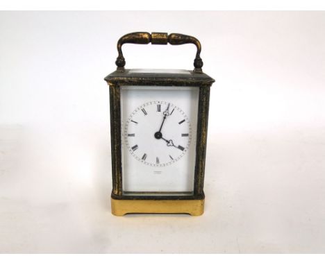 Scherer of Paris two train brass carriage clock, with bevel glass, square enamel dial with Roman numerals, striking on a bell