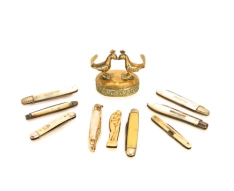 A Cast brass group of fighting cocks, four mother-of-pearl and silver bladed fruit knives and five others