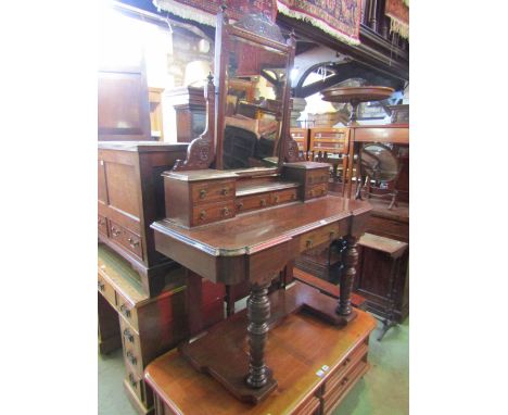 A late Victorian mahogany duchess dressing table, the central swing mirror of rectangular form with bevelled edge plate withi