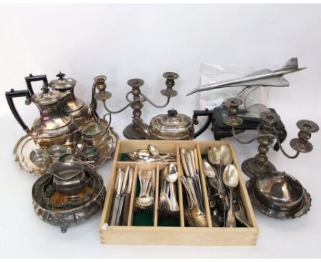 A mixed collection of silver plated items to include candelabra, tea sets, flatware; together with a further desk ornament of