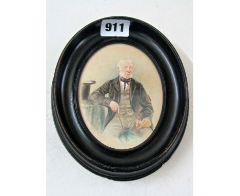 A 19th century miniature portrait of oval form showing a gentleman seated with his top hat on the table beside him, with extr