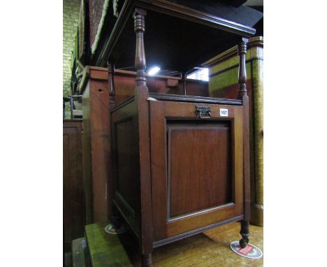 A late Victorian/Edwardian mahogany purdonian with panelled fall front beneath an open shelf flanked with turned columns