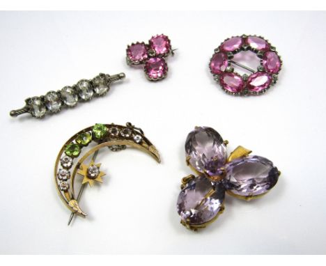 Mixed lot of brooches to include a large amethyst trefoil brooch, a rock crystal set silver brooch and three other silver pas