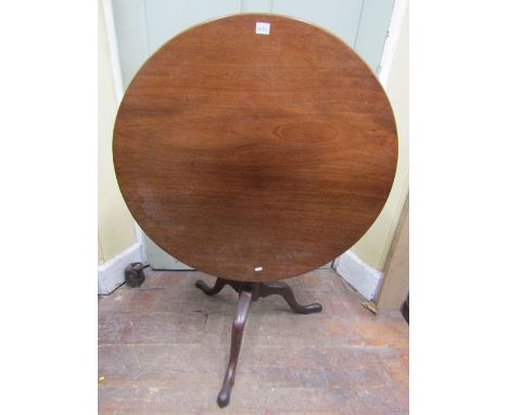 A Georgian mahogany snap top table, the circular one piece top raised on a turned pillar and tripod base with bird cage actio