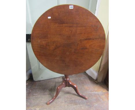 A Georgian mahogany snap top occasional table, raised on a vase shaped pillar and tripod, the single piece top 74cm in diamet