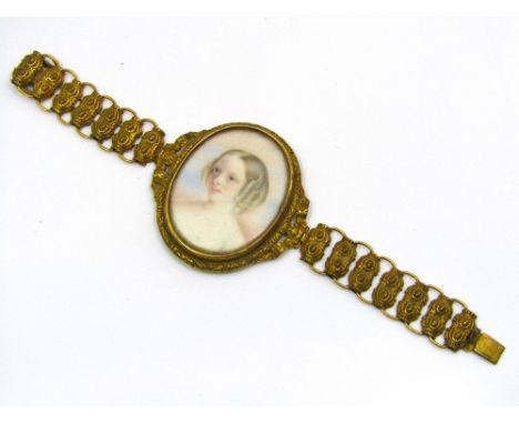 An early Victorian portrait bracelet depicting a young girl in high relief yellow metal frame, 28.5g total