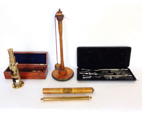 A mahogany cased students microscope; together with a cased set of compasses and measuring tools, a mauchlineware perpetual c