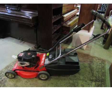 A Homelite HR-18XL petrol driven rotary lawn mower with Briggs and Stratton series 220 engine