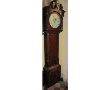 A Regency oak longcase clock with reeded column supports, the hood with swan neck cornice and gilded rosebud detail, enclosin