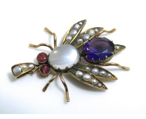 A 9ct gold gem set pendant in the form of an insect, set with cabochon moonstone, amethyst, rubies and seed pearls to wings a