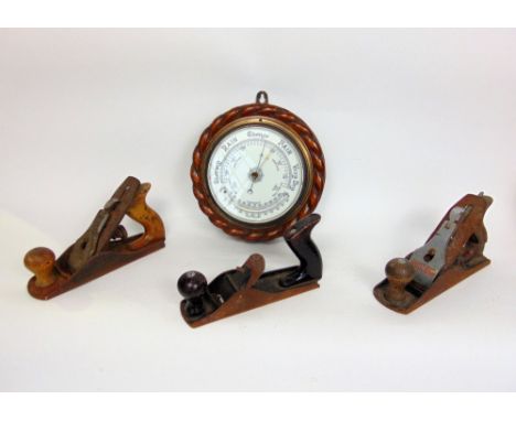 Circular boule barometer with carved rope twist frames; together with three woodworking planes, one by Acorn number 4, Stanle