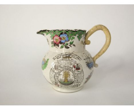 A 19th century farmers arms jug with printed and infilled decoration including dogs, children playing at shuttlecock and batt