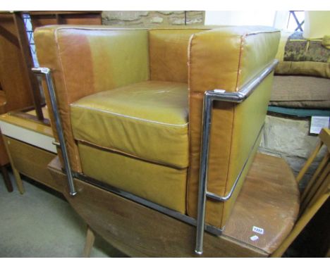 A Corbusier style club lounge chair of cubist form with light brown upholstered seat within a polished chrome framework 