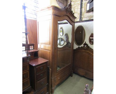 A 19th century continental oak bedroom suite comprising knockdown single wardrobe enclosed by a three quarter length arched m