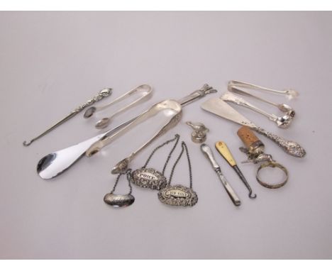Small Georgian silver ladle, sugar tongs, decanter labels together with silver handled manicure tools and small plated ware