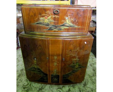 A Rivington cocktail cabinet in walnut with applied chinoiserie detail, bow fronted outline, fall front revealing a fitted in