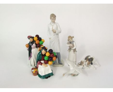 A Lladro model of a terrier examining a butterfly on its tail, a Lladro figure of a little girl holding lamb and a Lladro fig