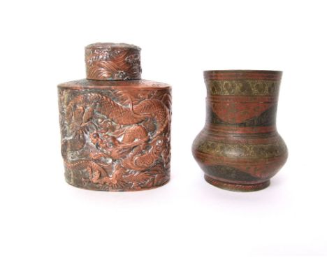 A Japanese embossed copper caddy of oval form, decorate in deep relief with coiled dragon/sea serpent, 12cm high; together wi