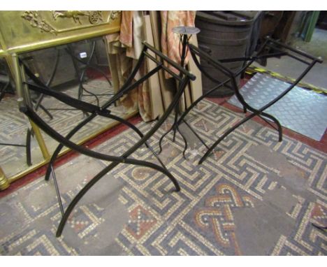 An iron work candle stand on tripod base and a pair of folding iron work tray stands, with gilded detail in the Regency style