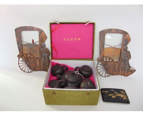 Mixed chinoiserie lot include a boxed pottery tea set, a lacquered card case and pair of copper photograph frames in the form