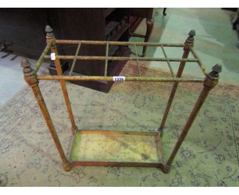 A Victorian iron work ten divisional stick stand on turned supports with drip tray with original wood grained finish