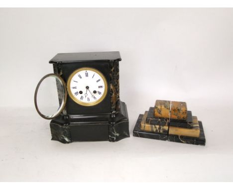 19th century black slate clock garniture, the clock with two train enamelled dial fitted with Roman numerals, 23cm high (3)