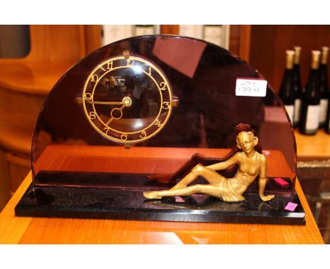 Art Deco Copper mirrored Clock with figural decoration 
