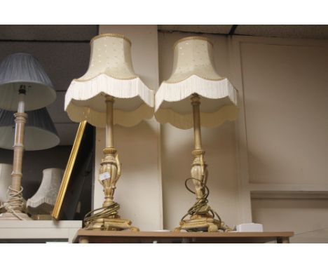 A PAIR OF ORNATE TABLE LAMPS WITH CREAM LAMP SHADES