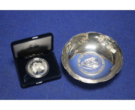 A HALL MARKED SILVER SIR WINSTON CHURCHILL DISH AND A U S EAGLE COIN