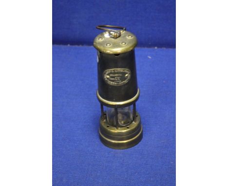 A HOOKLEY LAMP AND LIMELIGHT MINORS LAMP