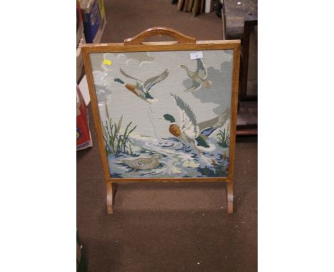 A WOVEN FIRE SCREEN DEPICTING DUCKS