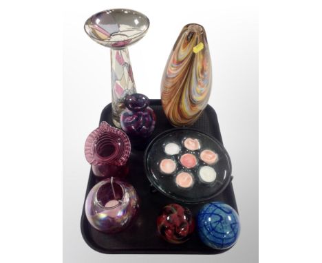 Seven pieces of coloured studio glass and a glass tea light holder 