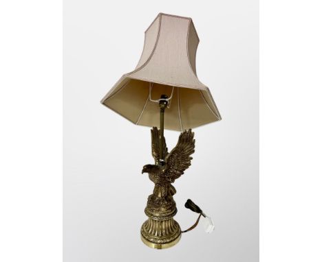 An ornate gilt brass eagle lamp base (a/f) CONDITION REPORT: Break just below the bulb. 