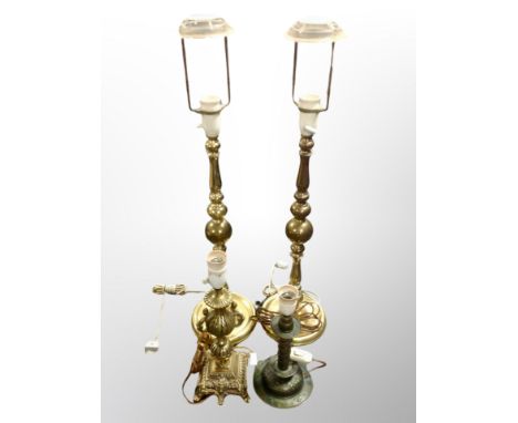 A pair of Danish brass lamp bases, height 74 cm and two further examples 