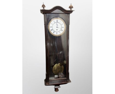 A Continental eight day wall clock with enamel dial, height 105 cm 