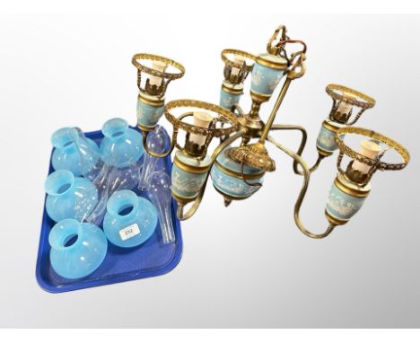 A Scandinavian gilt brass and ceramic five branch chandelier with blue glass shades and chimneys, diameter 50 cm 