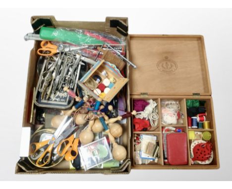 A box of Danish teak sewing box and contents, bobbin stands, related tools, buttons etc 