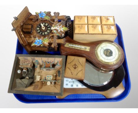 A Continental cuckoo clock with weights together with a two barometers, small wooden spice rack, hand mirror etc 