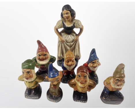 A group of mid century ceramic Snow white and the Seven Dwarfs figures, (Snow White) height 16 cm.
