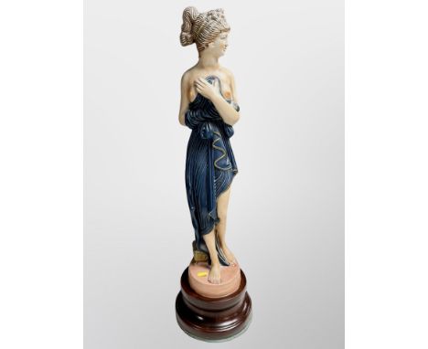 A large ceramic figure of a scantily-clad female, height 74 cm 