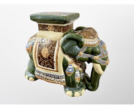 A glazed ceramic elephant plant stand, height 43 cm 