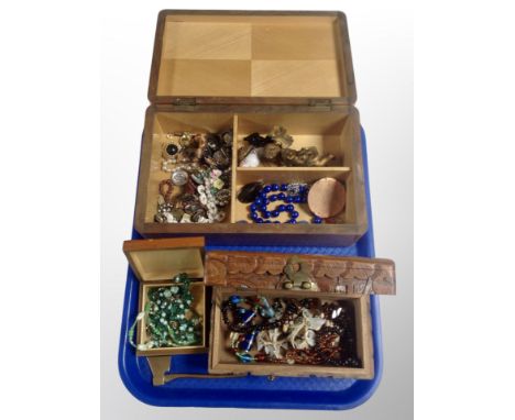 A teak jewellery box and two others containing costume jewellery, beaded necklaces, miniature brass axe etc 