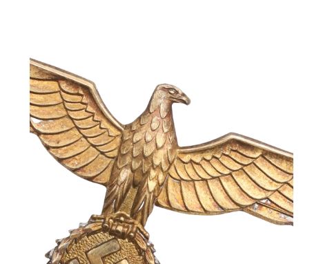 A GERMAN ARMY GENERAL'S BREAST EAGLE. Gilt brass type with broad outstretched wings and swastika in laurel wreath, with long 