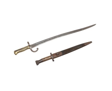 AN 1888 PATTERN BAYONET AND SCABBARD, AND A FRENCH CHASSEPOT BAYONET. An 1888 pattern bayonet with a 30 cm pointed, double ed