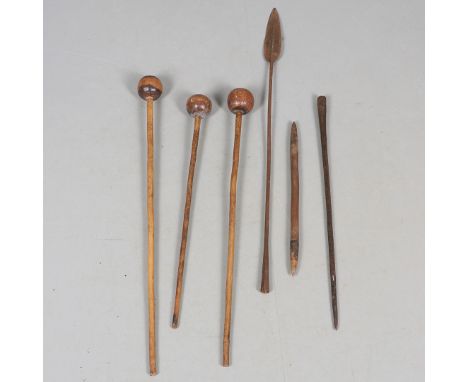 THREE SIMILAR PRIMITIVE KNOBKERRIE AND A SPEAR. Three similar clubs with ball shaped ends on slender shafts, 62, 74, 80 cm, a