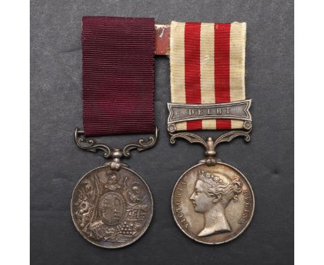 AN INDIAN MUTINY AND LONG SERVICE PAIR TO THE 61ST FOOT. An Indian Mutiny Medal with Delhi clasp named to T. Cavanagh 61st Re